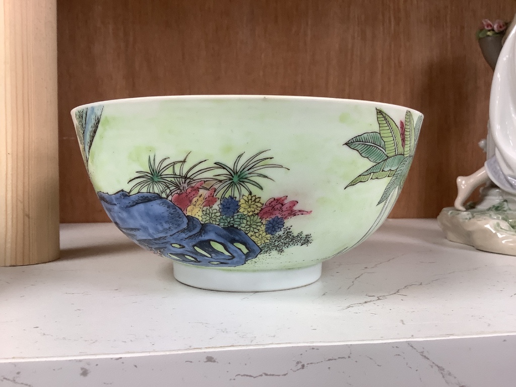 A Chinese blue and white footed porcelain bowl, Kangxi mark to underside, c1900, 12cm diameter 6cm high, together with a further hand painted famille rose, 15cm diameter, 7cm high